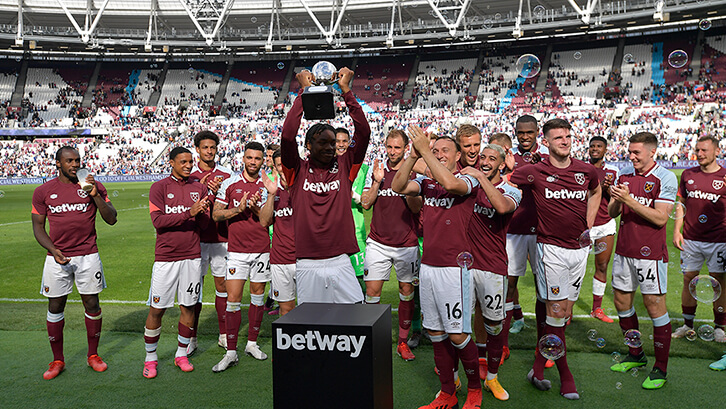Football team West Ham United lifting the Thropy from a Betway trophy stand